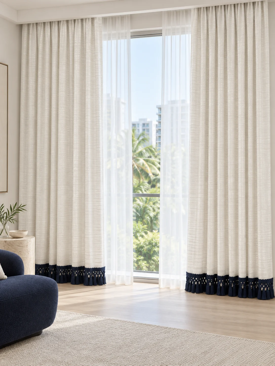 Ivory subtly horizontal textured curtain body and deep navy knotted/macrame tassel fringe at bottom hem — full-window AI design visualisation.