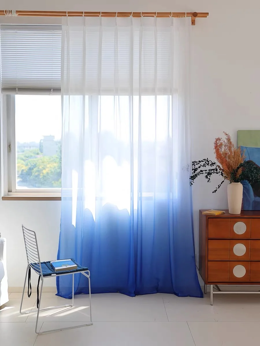 Blue ombré transition & translucent folds — close-up of the supplied curtain photograph.