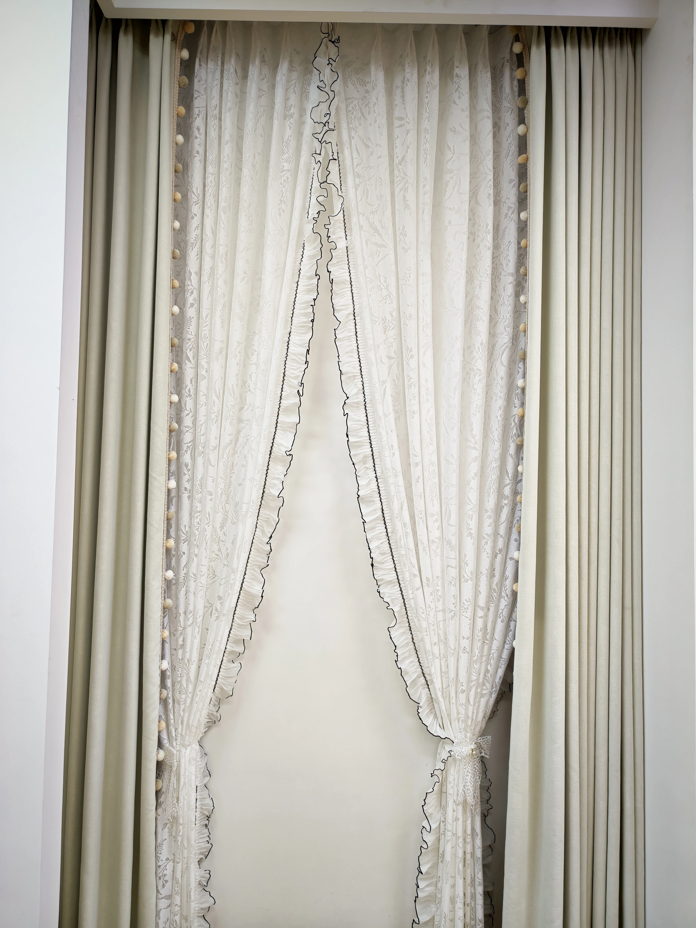 Botanical sheer, tonal trim & ruffled edge — close-up of the supplied curtain photograph.
