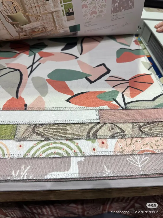 Stack of vibrant patterned fabrics – ideal for statement curtains, upholstery, or accent pieces in colorful interior design